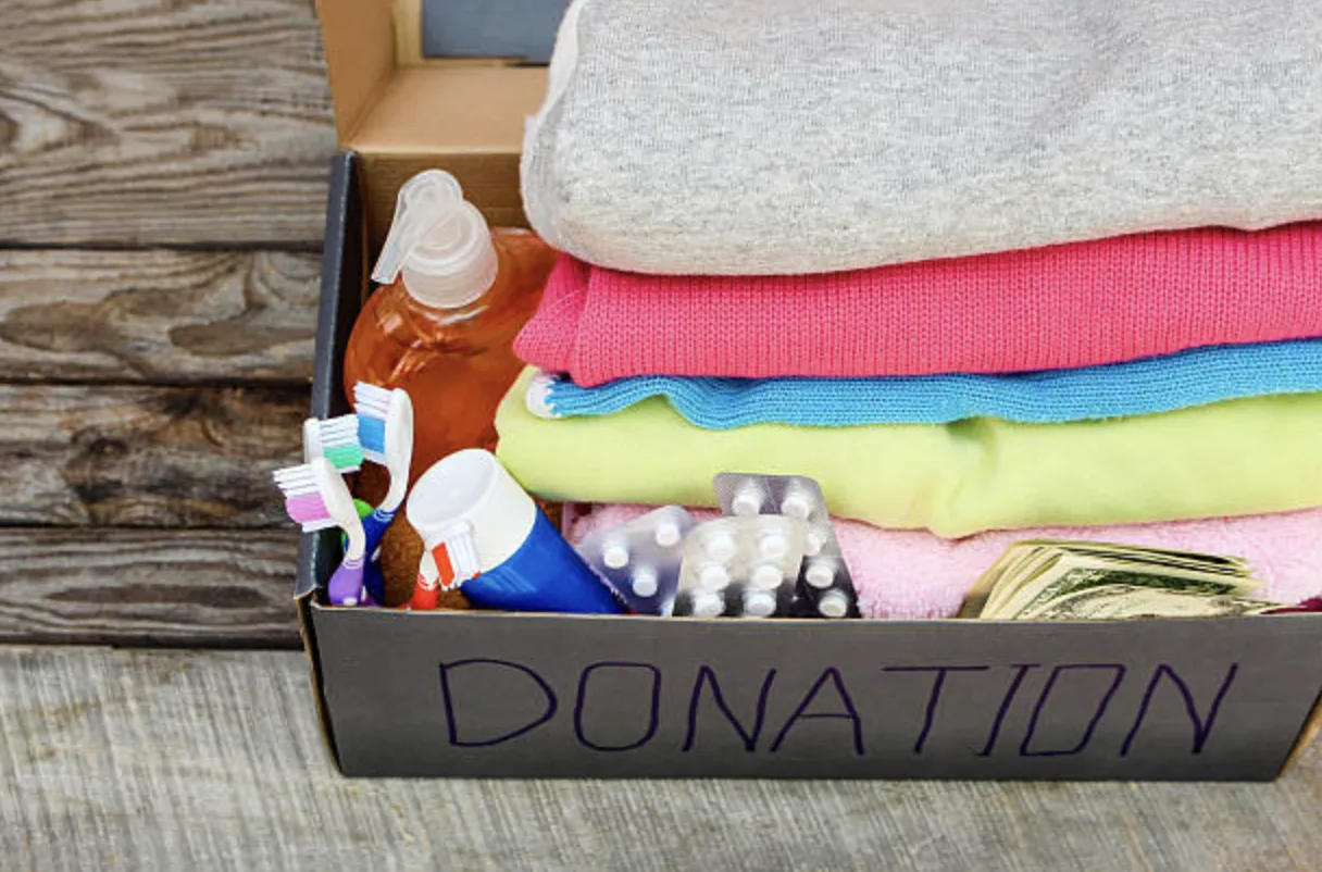 Donation box filled with clothes and supplies