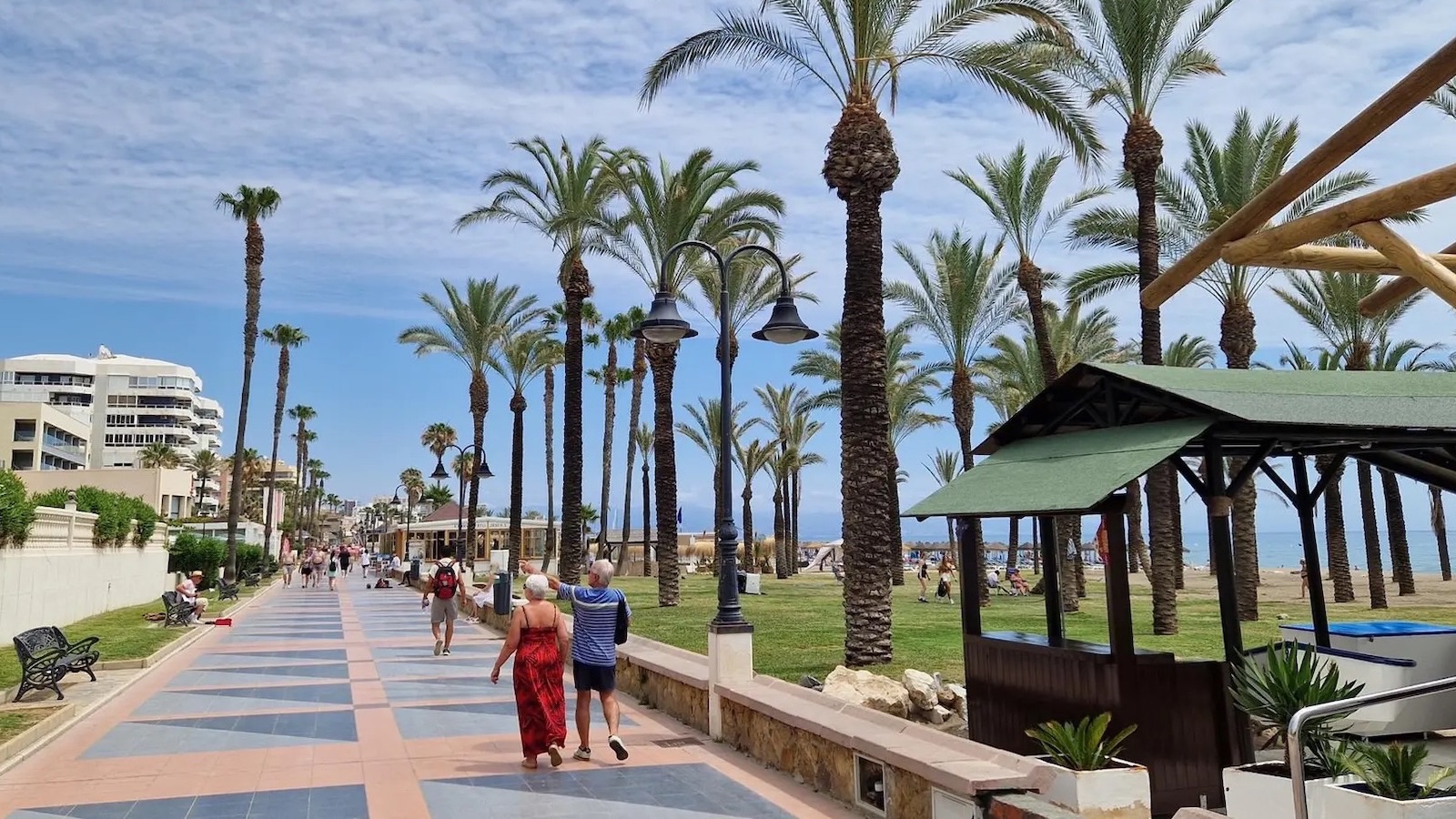 Palm-lined seafront promenade by the beach in Torremolinos